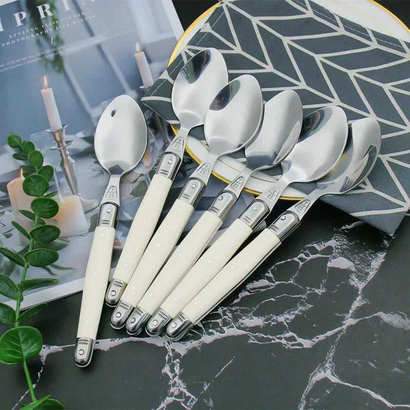 Elegant Silver Flatware Set with White Handles