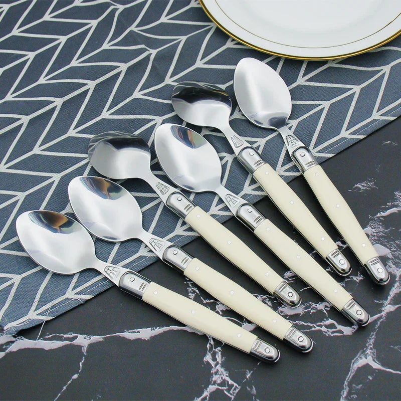Elegant Silver Flatware Set with White Handles