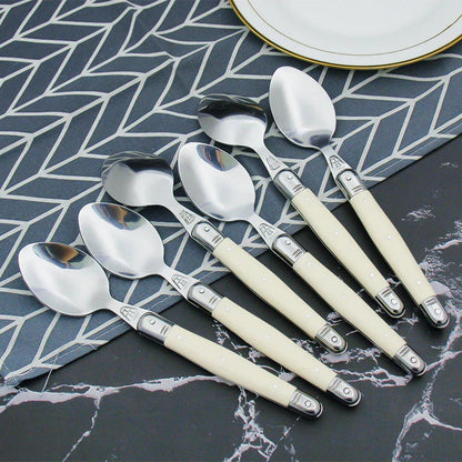 Elegant Silver Flatware Set with White Handles