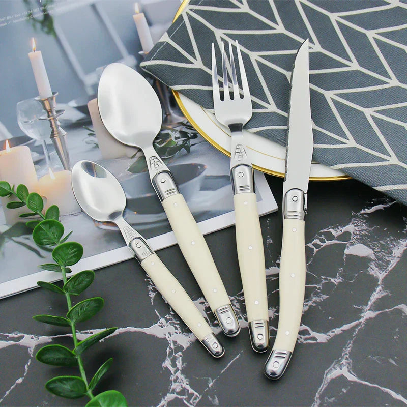 Elegant Silver Flatware Set with White Handles