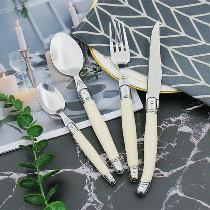 Elegant Silver Flatware Set with White Handles